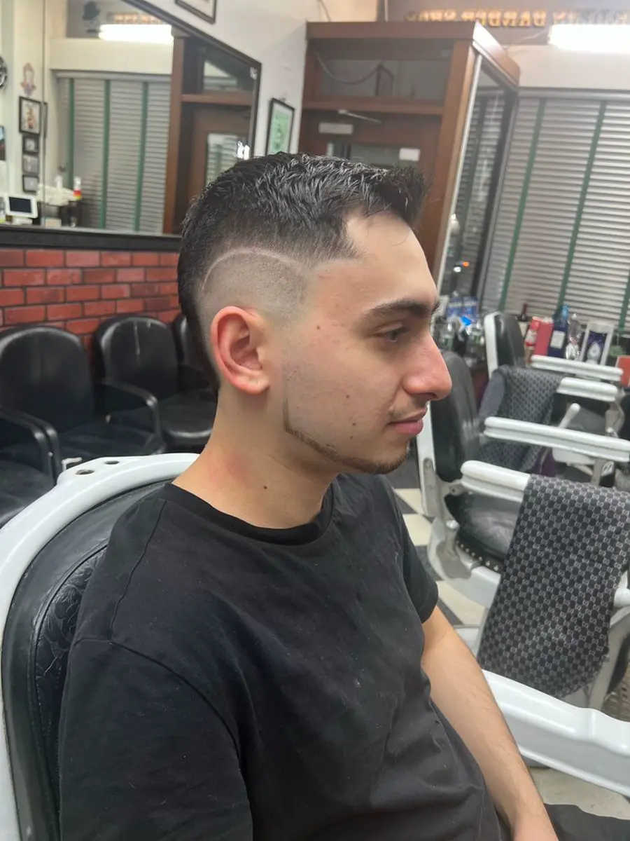 Taper fade with scissor top, barbershop on W 23rd St
