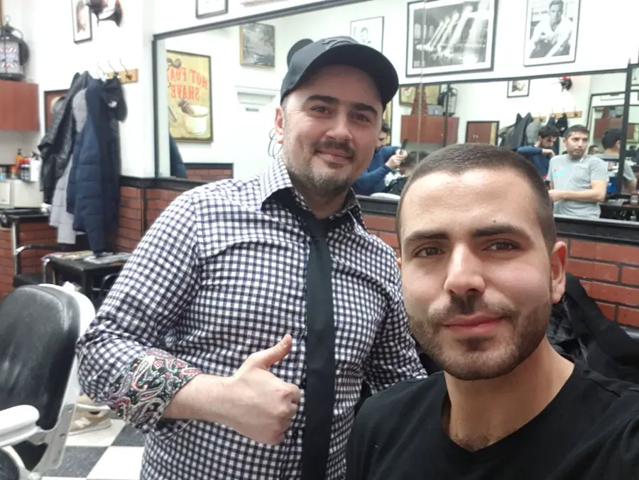 A happy customer with his barber at Chelsea Gardens
